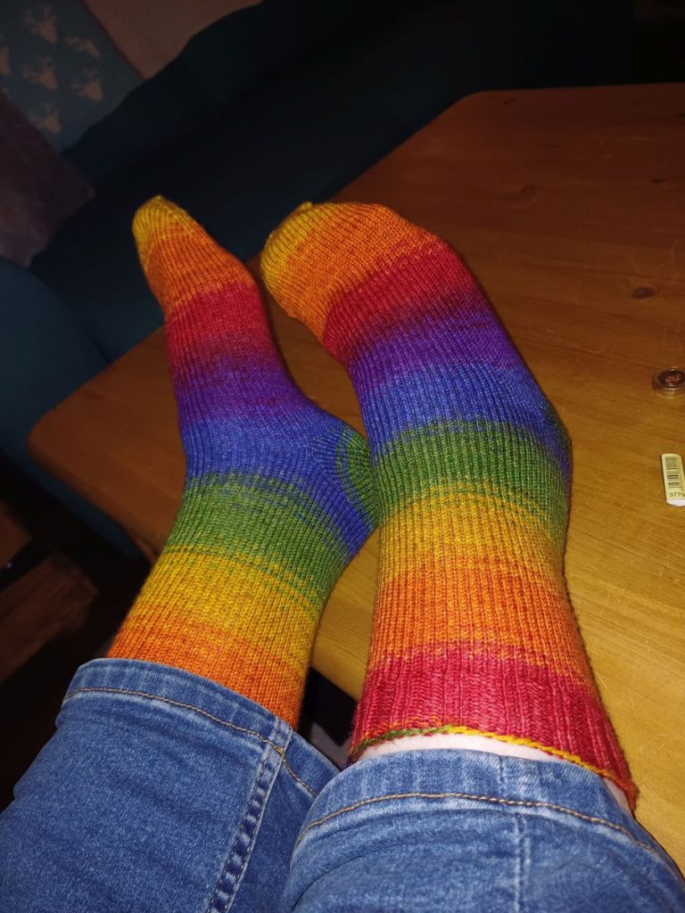 Picture shows rainbow coloured socks